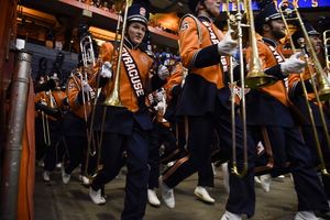 The Syracuse band comes marching in before the team's first home game against Rhode Island.